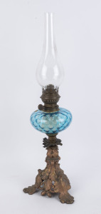 An antique kerosene lamp, cast metal oak leaf base, blue font, single burner with glass chimney, 19th century, ​62cm high overall