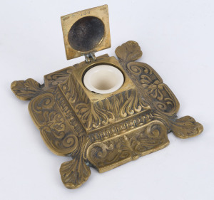 An antique English cast brass ink well with ceramic ink pot, circa 1870s, 16cm wide