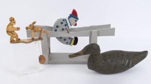 A vintage decoy duck, folk art rolling clown toy and handheld nodding donkey toy, 20th century, the duck 40cm long