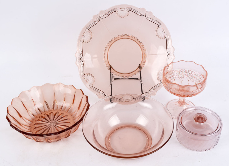 Five assorted pieces of pressed peach glass, 20th century, the plate 29cm wide