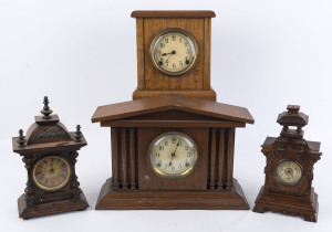 Two German bedroom alarm clocks, late 19th century, one by JUNGHANS in a walnut and brass decorated case, the other in oak with brass decoration, with a music box alarm movement. Together with two Australian timber mantel clocks fitted with American move
