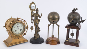 JUNGHANS, two spherical brass pillar clocks on mahogany stands, one decorated with cast spelter Putti, early 20th century. ​Along with a cast bronze "Diana" mystery clock on ebonised timber base, and a gold painted steel nautical style mantel clock with 