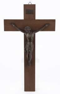 A wall mounted crucifix, cast bronze and oak, mid 20th century, 51cm high