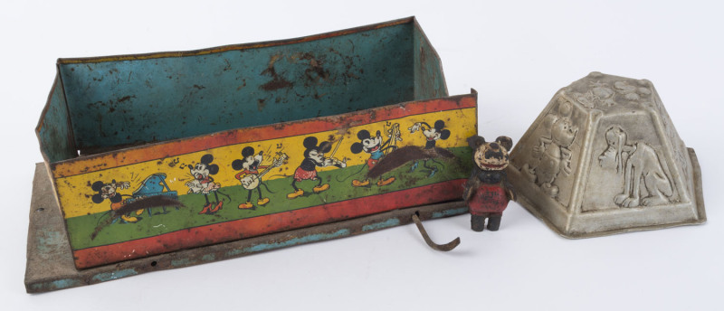 WALT DISNEY - MICKEY MOUSE: aluminium jelly mould, with pressed images of Mickey, Minnie, Pluto, Clarabelle & Horace, stamped 'MADE IN ENGLAND' on base, 8cm high,17cm width at base; also a small painted lead figurine of Mickey (missing feet) and large ope