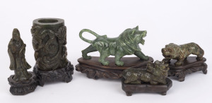 Group of five Chinese carved green jade ornaments, 20th century, all with fitted stands, the largest 13cm high