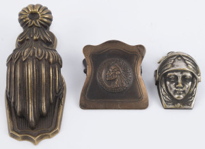 Three assorted antique cast metal letter clips, 19th and early 20th century, the largest 14.5cm high