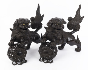 A pair of Chinese bronze foo dog ornaments, 20th century, ​41cm high, 53cm long