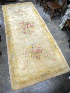 An Aubusson style wool rug with floral motif, 20th century, 320 x 135cm