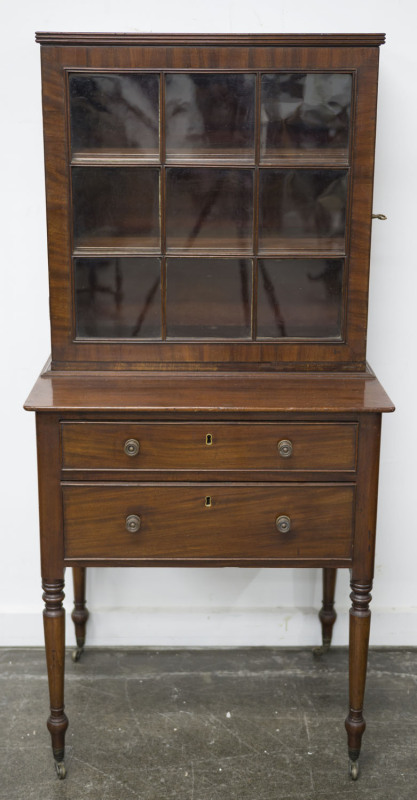 A Georgian mahogany ladies dwarf bookcase with two drawers, 19th century, 139cm high, 66cm wide, 52cm deep