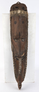Mwai mask, carved wood, tusk, shell and hair with earth pigments, Korongo Village, Middle Sepik, Papua New Guinea, ​88cm high