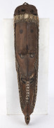 Mwai mask, carved wood, tusk, shell and hair with earth pigments, Korongo Village, Middle Sepik, Papua New Guinea, ​88cm high