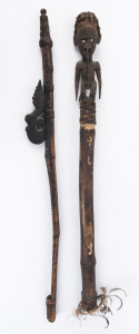 A spear thrower and a flute stopper, carved wood, bamboo, feather, shell, hair and fibre, Papua New Guinea, ​the larger 101cm high