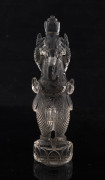 An Indian carved rock crystal statue of a four-armed Ganesh with crown, 19th century, ​13.5cm high