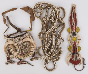 Three tribal adornments, dog tooth, tusk, shell, fibre and string with painted decoration, Papua New Guinea