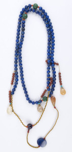 A Chinese court style necklace with lapis lazuli beads adorned with coral, agate, turquoise, rock crystals with rutile inclusions and yellow silk thread, Qing Dynasty, late 19th early 20th century, 110cm long