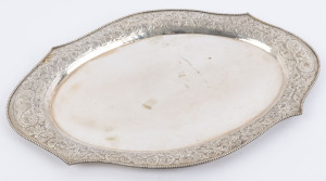 A Chinese silver serving tray with embossed floral and scroll work border and bead work rim, early 20th century, 45cm wide, 664 grams