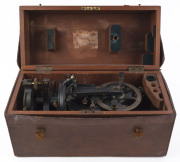 An antique theodolite in original mahogany box and leather field case, 19th century, the case 47cm wide