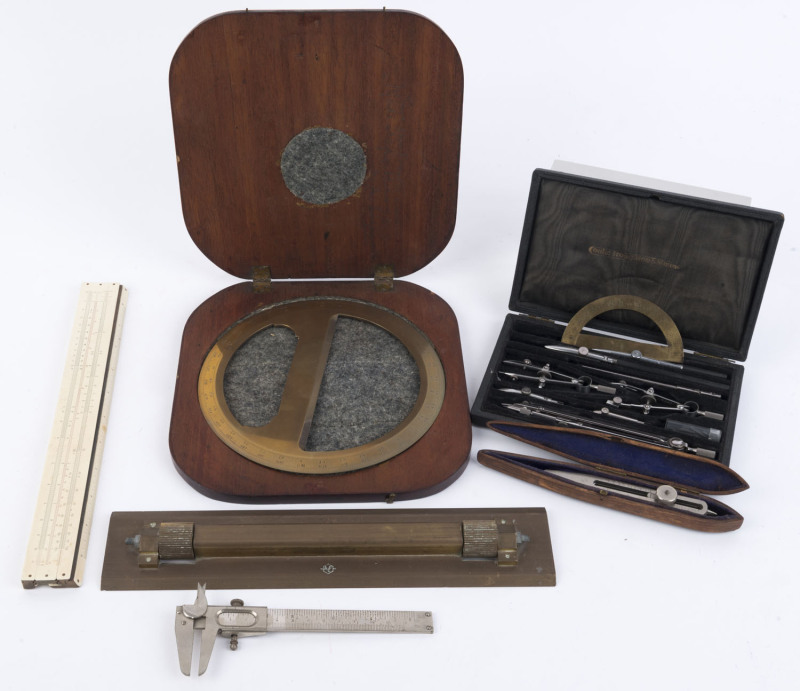 Surveyor's office equipment including Vernier callipers, slide rule, parallel rule, protractor in mahogany case, adjustable dividers, and a drawing set by COOKE TROUGHTON & SIMMS, (6 items),