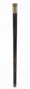 An antique portable drinking baton with ebonised shaft and brass mounts, late 19th century, ​51cm long