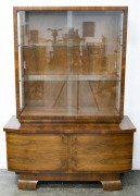 An Austrian Art Deco walnut display cabinet, circa 1925, 162cm high, 116cm wide, 47cm deep