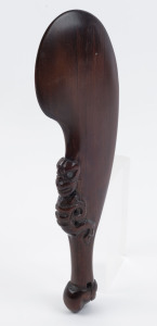 A Maori patu, carved wood and paua shell, 20th century, ​40cm long