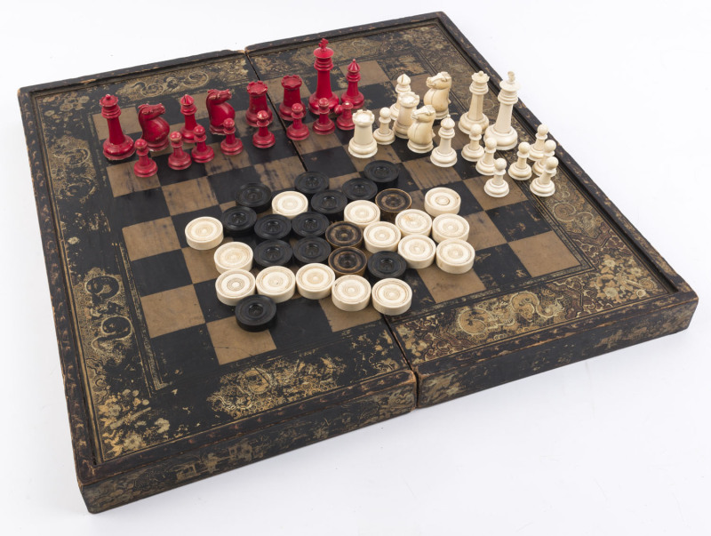 STAUNTON CHESS & DRAUGHTS SET: pieces mostly in ivory with the black draught pieces in ebony (except 3 which are stained ivory), housed in original hinged games box with a chinoiserie decoration on lacquered wood; tallest piece (King) 9cm high, board 56x5