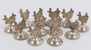 Set of 12 sterling silver place name holders, 20th century, stamped "Sterling, 925, Made In H.K.", 3.5cm high, 120 grams total