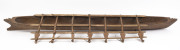 A large model outrigger canoe, carved wood and natural fibre with remains of piped clay, Samoa, mid 20th century, ​167cm long