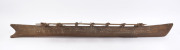 A large model outrigger canoe, carved wood and natural fibre with remains of piped clay, Samoa, mid 20th century, ​167cm long - 2