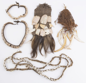 Four assorted artefacts including man's apron with shell attachments (Simbu Province), head cap with shell attachments (Sepik River), and two shell necklaces (Upper Sepik), early to mid 20th century.