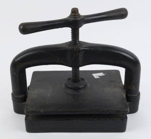 An antique book press, cast iron with black and gilt painted finish, 19th century, 135cm high, 40cm wide, 25cm deep, (Heavy!)