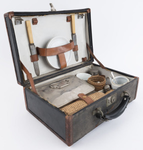 An antique picnic set in leather case, originally a setting for two with some losses, early 20th century, 36cm wide