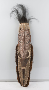 An ancestral spirit mask, carved wood, feather, fibre, tusk, shell, clay and earth pigments, Papua New Guinea, ​95cm high
