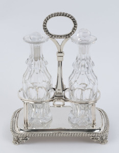 A Georgian sterling silver two bottle cruet set, stamped "C.P.", London, circa 1824, 21.5cm high