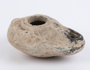 A small terracotta votive oil lamp, Palestine, Roman period, 1st century A.D. With CofA from Halcyon Antiques and Antiquities, Newcastle, Australia. 9cm wide