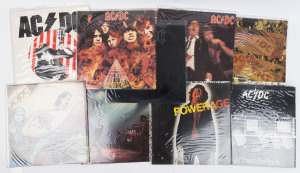 AC/DC: complete run of 1975-1980 albums on vinyl comprising "High Voltage", "T.N.T.", "Dirty Deeds Done Dirt Cheap", "Let There Be Rock" (2, different pressings/sleeves, one signed on front by Angus Young), "Powerage", "If You Want Blood", "Highway to Hel