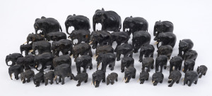 A collection of 46 carved ebony elephant statues19th and 20th century, ​the largest 14cm high