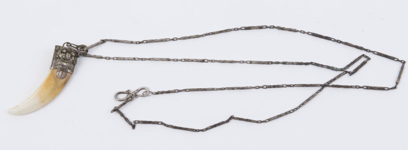 Tiger Tooth necklace with decorative mount, possibly Balinese, c.1950s.