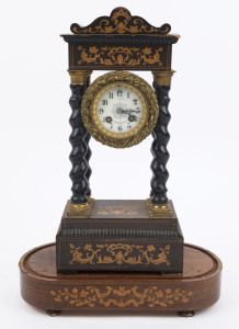 A French portico clock, late 19th century. Veneered in ebony with boxwood floral marquetry inlay and four barley twist columns fitted with cast and gilt capitals, the case now fitted with an associated French 8 day time and strike movement, (bell and pend