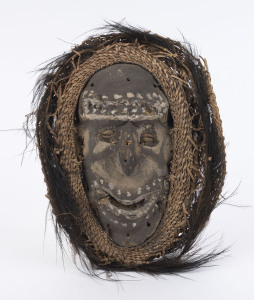 An early mask, woven fibre board, feather, shell and clay with earth pigment decoration, Middle Sepik, Papua New Guinea, circa 1950, ​38cm high
