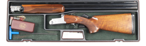 CASED RIZZINI U/O SINGLE TRIGGER VERTEX TRAP GUN: 12G; 2¾" chambers, tight on the face; 30" barrels with ventilated machine cut top rib; exc bores; choked MOD & MOD; retains 98% original blue finish to barrel, t/guard & top lever; borderline engraved acti