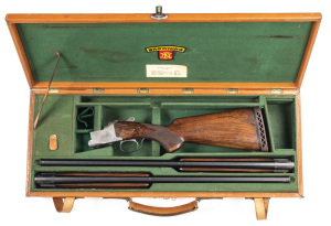 CASED FN BROWNING BI C GRADE U/O SINGLE TRIGGER SHOTGUN: with 2 sets of barrels engraved SPECIAL to the lhs of the breeches of both; 12G; & chambered for 3" magnums; 28" ventilated ribs; choked MOD & MOD, & FULL & MOD; exc bores; fine foliate engraved act