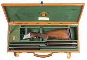 CASED FN BROWNING BI C GRADE U/O SINGLE TRIGGER SHOTGUN: with 2 sets of barrels engraved SPECIAL to the lhs of the breeches of both; 12G; & chambered for 3" magnums; 28" ventilated ribs; choked MOD & MOD, & FULL & MOD; exc bores; fine foliate engraved act