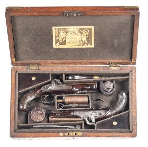 CASED PAIR OF PERCUSSION TRAVELLING PISTOLS by H.W. MORTIMER & SON: 52 Cal; 4" octagonal barrels; f. bores; brass dovetail front sights, notched rear sights at the tang; both barrels inscribed MORTIMER & SON LONDON MAKERS TO HIS MAJESTY; borderline & foli