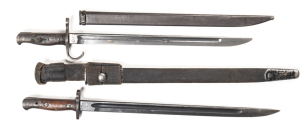 LOT 2 BAYONETS: JAPANESE TYPE 30 HOOKED QUILLION: 15¼" single fuller blade with several areas of staining; NGOYA ARSENAL mark to ricasso; fair wooden grips; complete with steel scabbard. LITHGOW PATT 1907; g. 16.75" blade; ricasso marked MA 1907 LITHGOW 