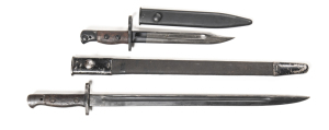 LOT X 2 BRITISH BAYONETS: 1907 PATTERN: g. 17" blade; ricasso marked WILKINSON & issue date of 1917; f to g grips; complete with sheet steel mounted leather scabbard. NO.5 MKI JUNGLE CARBINE BAYONET: 7.9" blade with areas of light staining; g. wooden gri