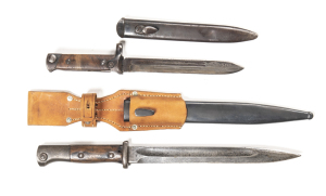 LOT X 2 BAYONETS: ITALIAN FOLDING: for the M.1938 Mannlicher Cacarno rifle: g. 7" blade; plain wooden grips & hilt; complete with correct steel scabbard. GERMAN SEITENGEWEHR M 84/78 3RD MODEL: 9.75" blade with a mottled grey finish; ricasso marked E. SIE