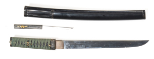 JAPANESE TANTO: 12” blade with a couple of fine chips to the edge; no hamon line visible; ornate Fuchi with Samurai, wild boar & foliage; tang signed KANEMOTA ? ?; the hilt bound with green cotton binding; gold embossed Menuki; black same to grip; gold em