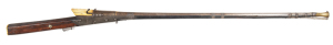 INDIAN TORADOR MATCHLOCK MUSKET: 22 bore; 47½" rnd watered steel barrel with gold damascene to flared muzzle & to breech areas, integral pan with enfolding cover; standard serpentine type lock with ornate trigger & side plates of nielloed steel; g. cond f