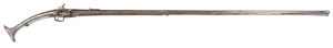 ALBANIAN STEEL MOUNTED MIQUELET GUN: .62" Cal; 55" 3 stage round to octagonal barrel with characters stamped to breech & fluting to transition section; g. cond lock, action a/f; decorative metal sheathed full stock includes 5 engraved brass barrel bands, 